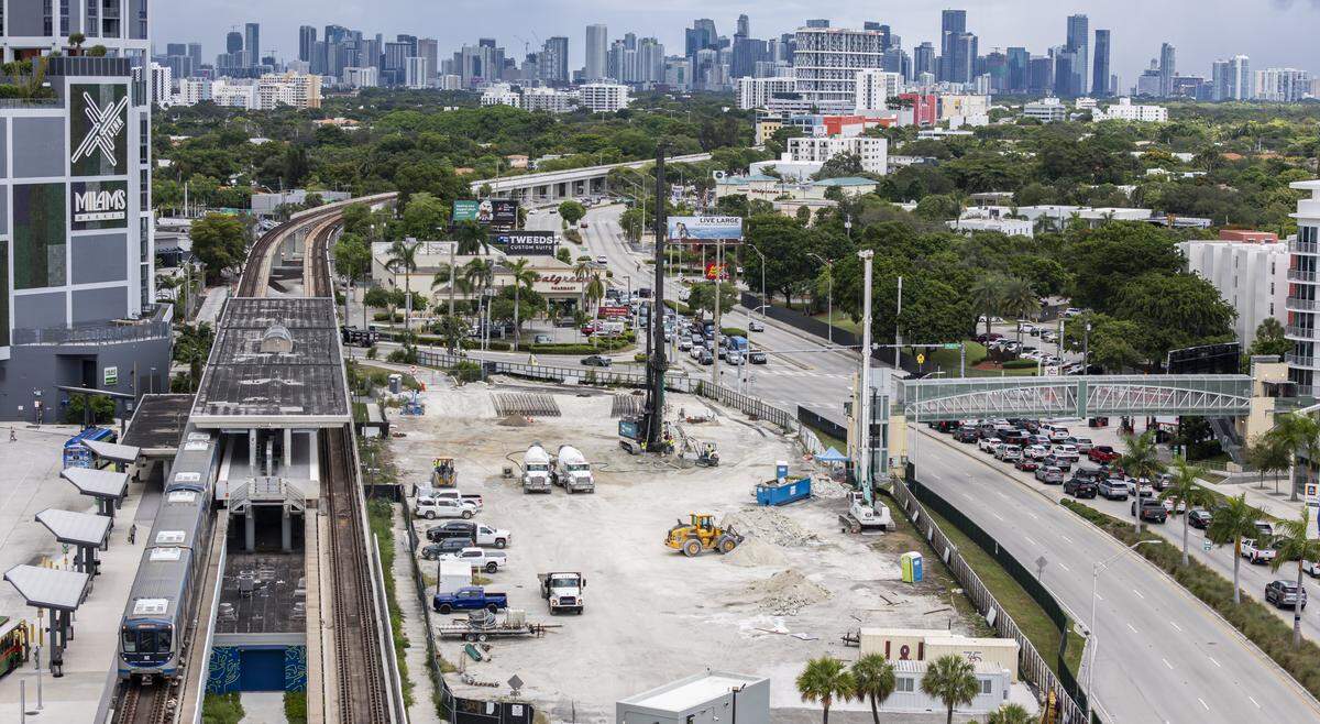 A Metrorail train departs from the Douglas Road Station on Thursday, Aug. 7, 2025, in Miami, Fla. City of Miami officials approved the Transit Station Neighborhood Development, which will allow for transit "nodes" to be built surrounding rail stations that allow for increased development and affordable housing within a mile of each station.