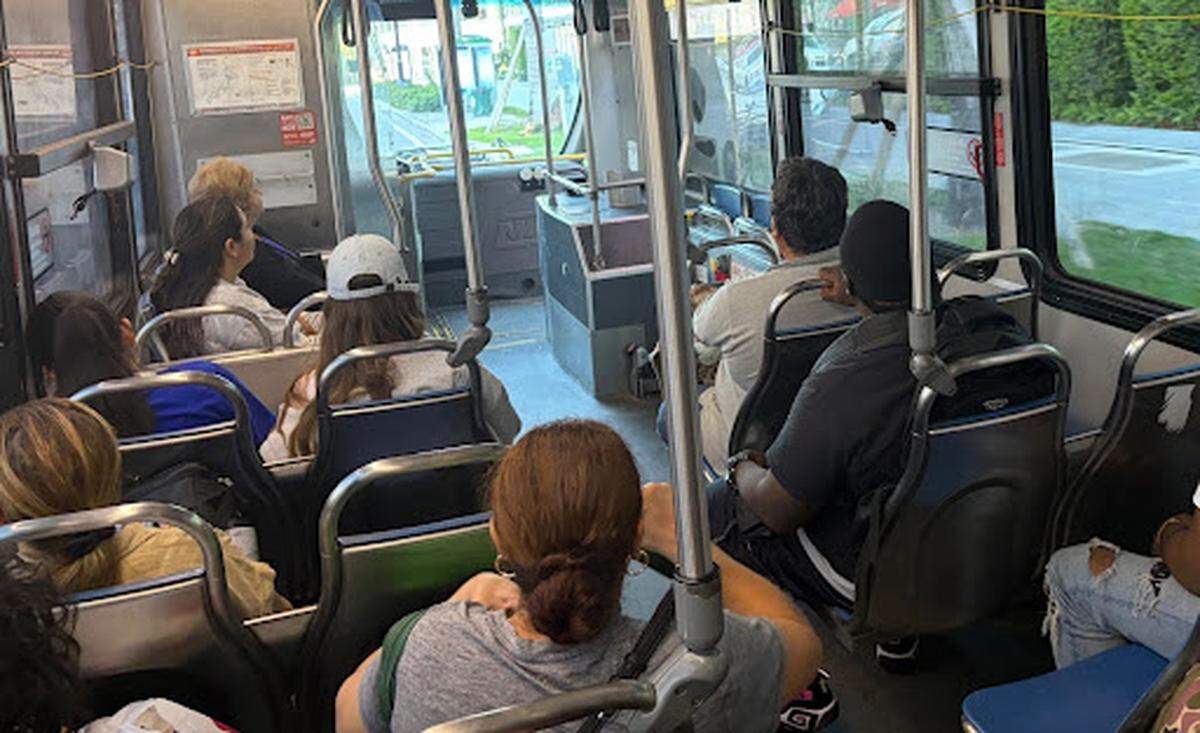 Passengers of the Route 3 bus riding along Biscayne Boulevard.