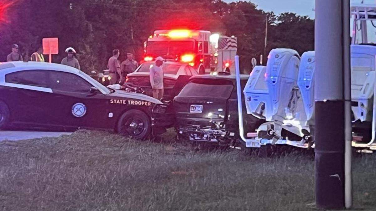 A Range Rover SUV is parked after crashing into a boat being transported on a trailer  on U.S. 1 in Islamorada in the Florida Keys Tuesday, Nov. 4, 2025.  Florida Highway Patrol troopers were pursuing him after he sped away during a traffic stop.