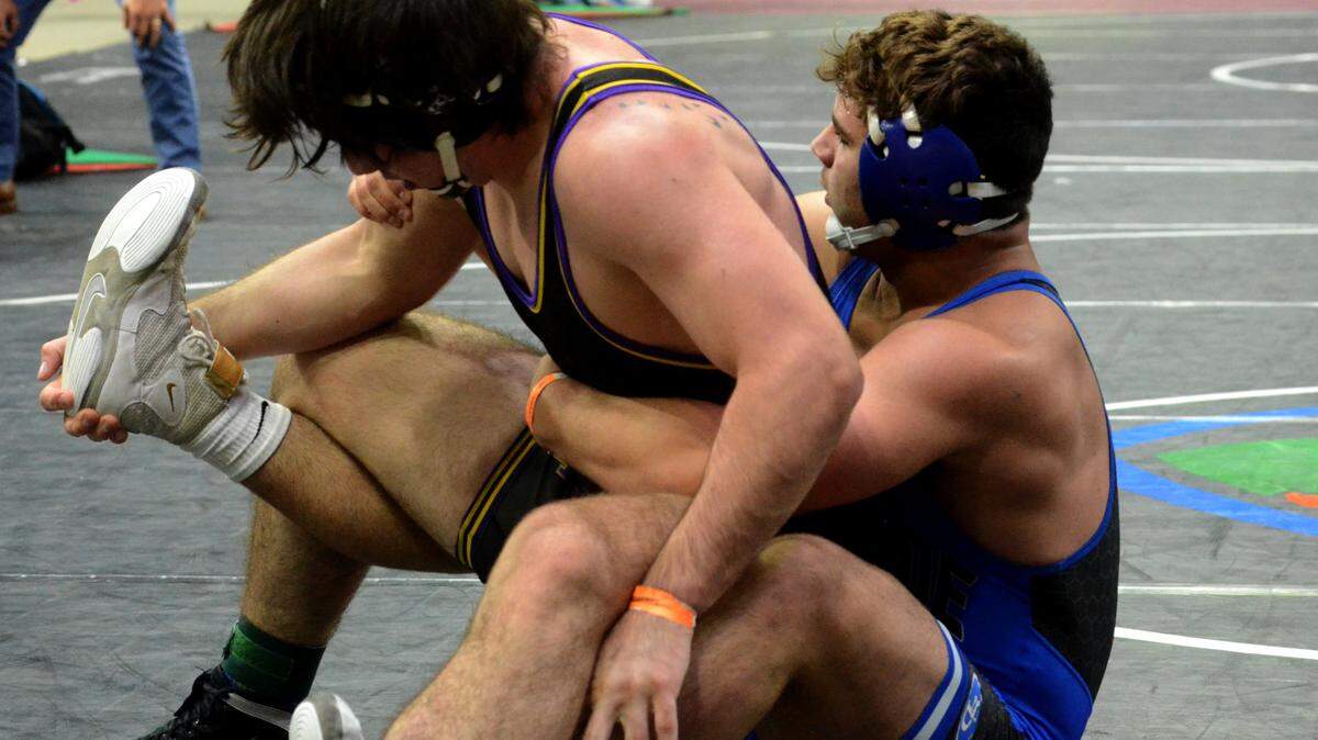 South Dade freshman Sawyer Bartelt works his way to a Class 3A 195-pound semifinals win against Fort Pierce Central senior Steven Krantz on Saturday at the FHSAA state wrestling championships at Silver Spurs Arena in Kissimmee.
