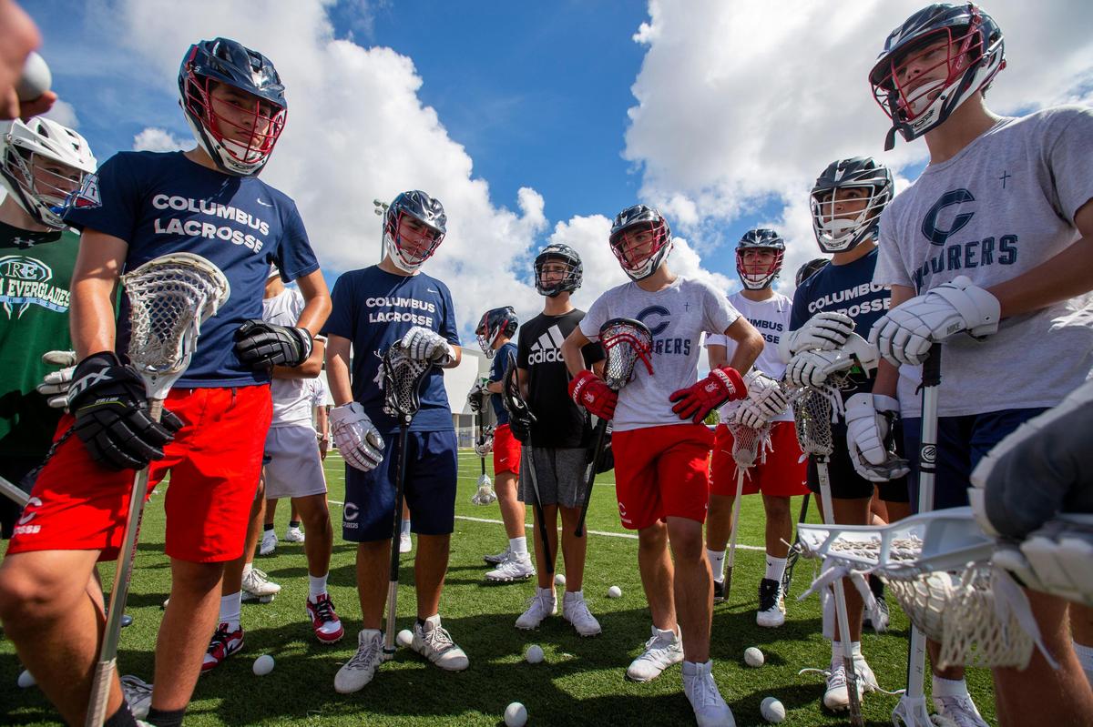 Local high school lacrosse players from South Florida gather during a lacrosse clinic.