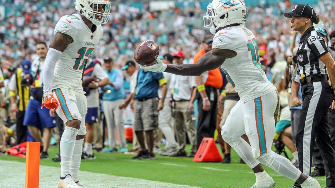 Miami Dolphins wide receiver Jaylen Waddle (17) and wide receiver Tyreek Hill (10) celebrate Hills touchdown in the third quarter at Hard Rock Stadium in Miami on Sunday, November 13, 2022.