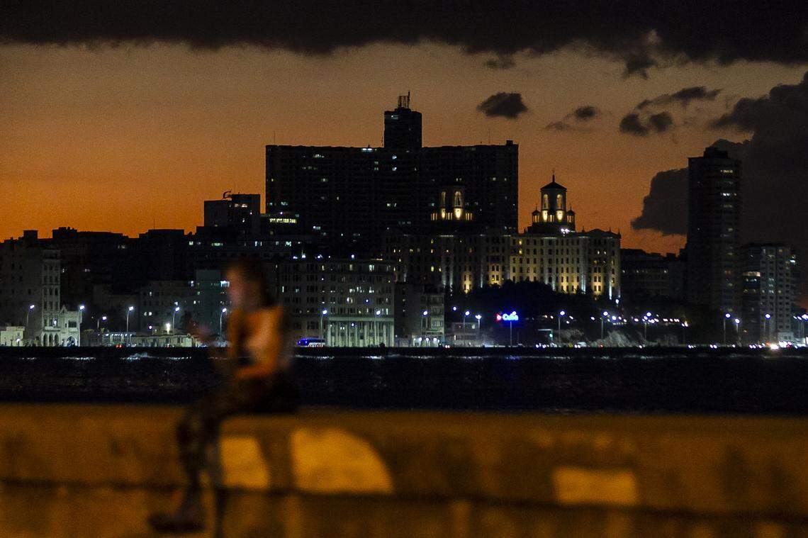A curve in the Malecón highlights the Havana skyline. The Hotel Nacional can be seen on the right.