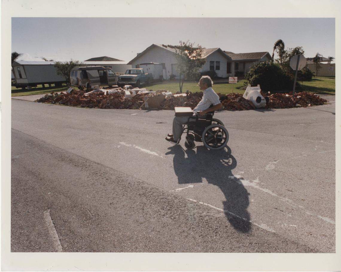 James Broderick did not have a tie-down permit for the trailer, at left, next to his house and couldn’t move out and live there while workers repaired the interior of his hurricane-damaged home.