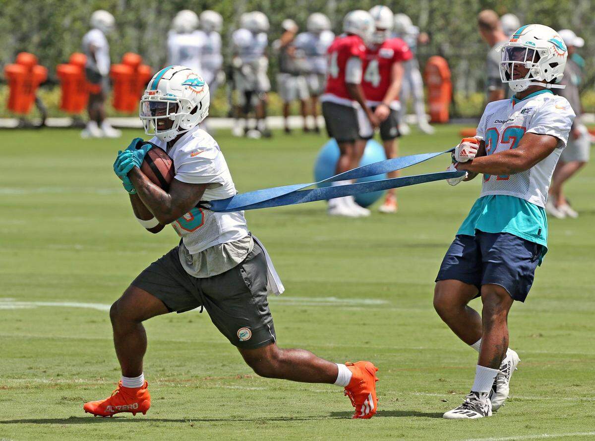 Miami Dolphins running back Salvon Ahmed (26) and running back Myles Gaskin (37) workout together during practice at Baptist Health Training Complex in Miami Gardens on Thursday, September 9, 2021.