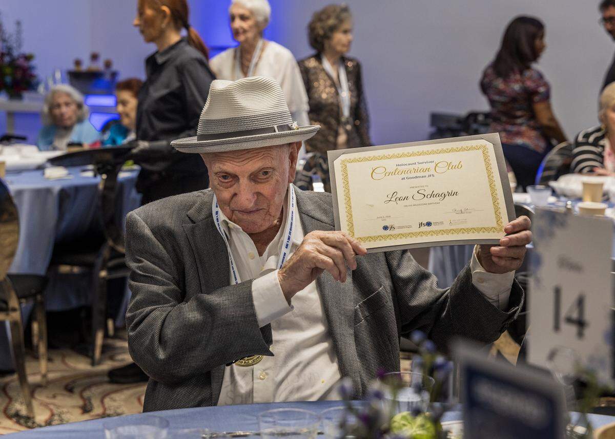 Leon Schagrin, 100, born in&nbsp;Grybów, Poland, holds up a recognition given to him on Holocaust Survivor Day by the Goodman Family Jewish Services. 