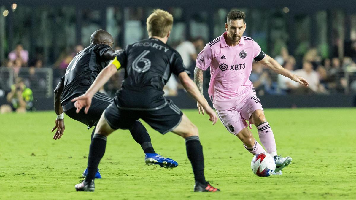 Inter Miami forward Lionel Messi (10) tries to make his way past Nashville SC midfielders Brian Anunga (27) and Dax McCarty (6) in the first half of an MLS match at DRV PNK Stadium on Wednesday, Aug. 30, 2023, in Fort Lauderdale, Fla.