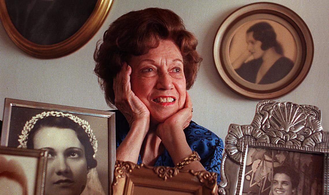 Elena Ruz, the late inventor of the namesake sandwich of Cuban origins, posed in her Kendall apartment among vintage photos in 1986. Ruz died in 2011 at age 102.