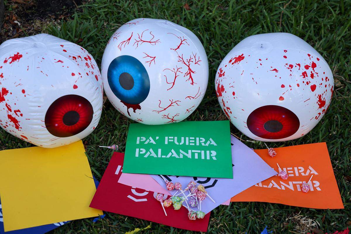 Props from the protests displayed on the lawn after a small group of protestors gathered around the mall entrance, wielding bright signs that conveyed messages calling for increased accountability and transparency from the tech giant on Tuesday, March 3, 2026, at the entrance of Aventura Mall in Aventura, Florida.
