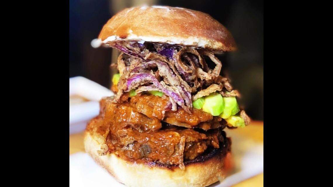 The Asado sandwich at Mr. & Mrs. Bun piles a familiar Peruvian roasted pork dish into a sandwich.