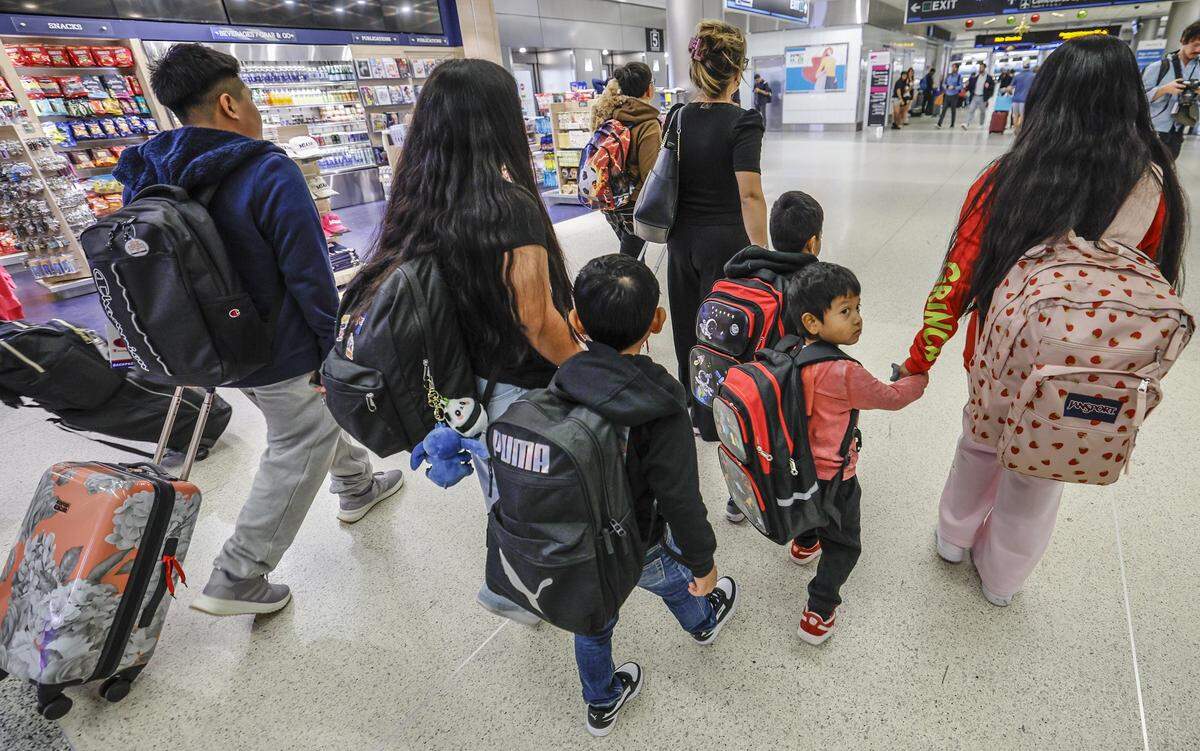 Seven children from six families are flown to Guatemala, departing from Miami International Airport on Dec. 4, 2025. 