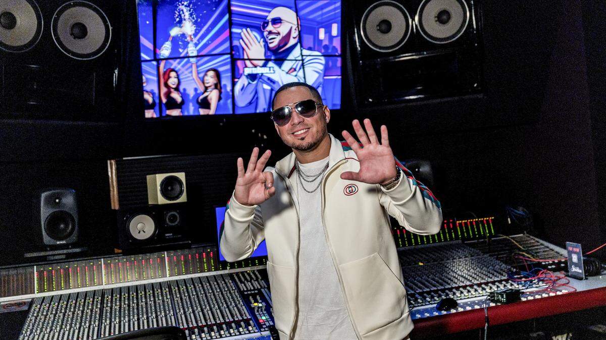 DJ/producer IAmChino flashes the “305” sign at his friend Pitbull’s Mr. 305 recording studios in Hialeah. The two men, who attended the same middle and high schools five years apart, have collaborated on a number of songs since meeting two decades ago when running in the same circles in Miami.
