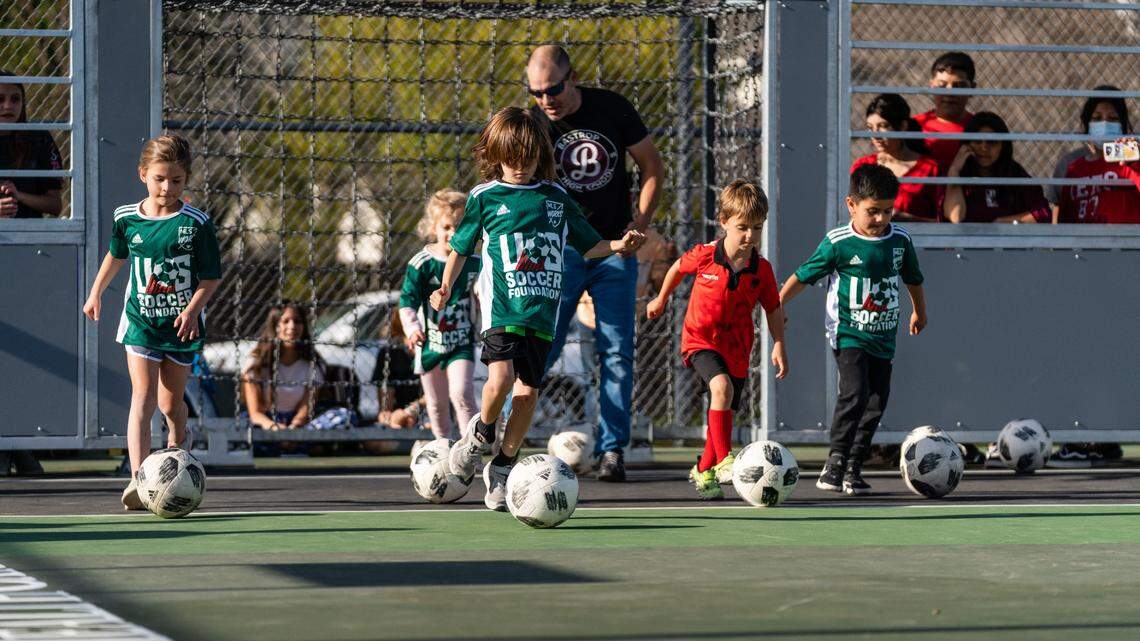 Kids demonstrate their ball-handling skills as part of a U.S. Soccer Foundation program at a middle school mini-pitch in the Austin, Tex., suburb of Bastrop in 2022.