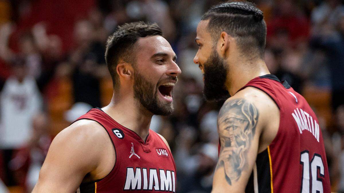 Miami Heat forward Caleb Martin (16) celebrates with guard Max Strus (31) after dunking against the Memphis Grizzlies during the fourth quarter of an NBA game at Miami-Dade Arena on Wednesday, March 15, 2023, in Miami.