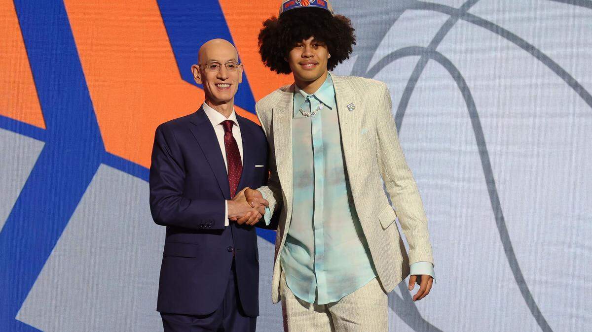 Jun 26, 2024; Brooklyn, NY, USA; Kyshawn George poses for photos with NBA commissioner Adam Silver after being selected in the first round by the New York Knicks in the 2024 NBA Draft at Barclays Center. Mandatory Credit: Brad Penner-USA TODAY Sports