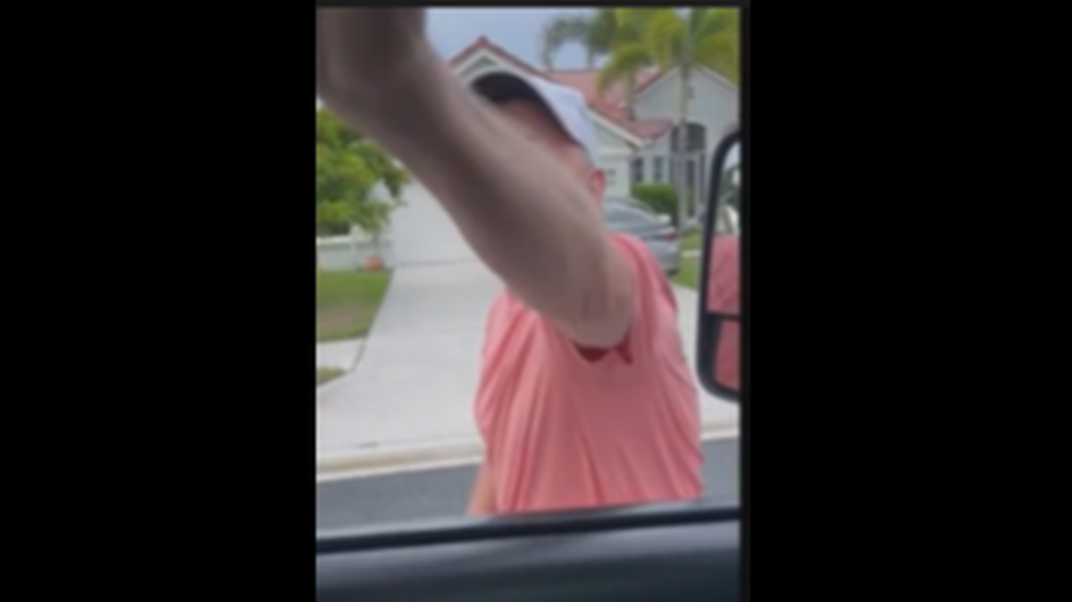 Video of the incident was shared by WFLA and shows the two drivers came to blows in the 1200 block of SW Briarwood Drive in Port St Lucie.