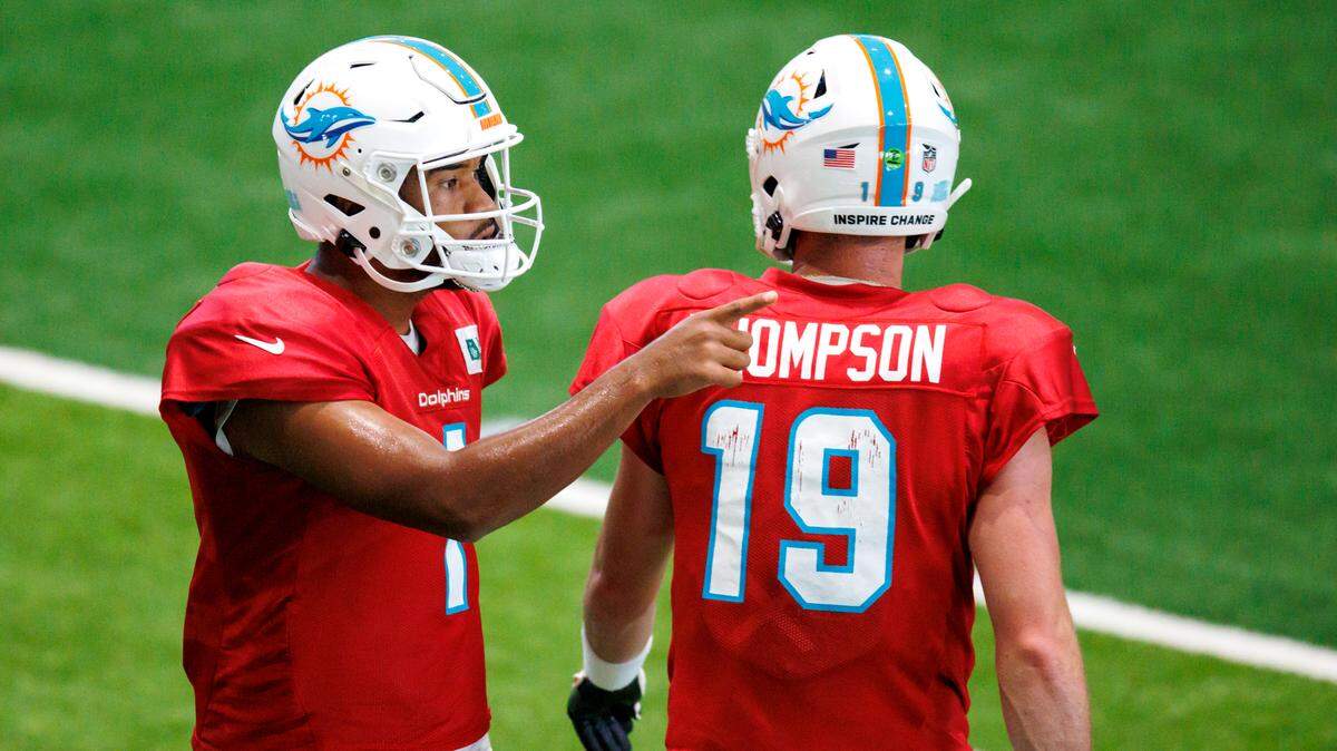Miami Dolphins quarterbacks Tua Tagovailoa (1) and Skylar Thompson (19) does drills during NFL football training camp at Baptist Health Training Complex in Hard Rock Stadium on Thursday, August 18, 2022 in Miami Gardens, Florida.