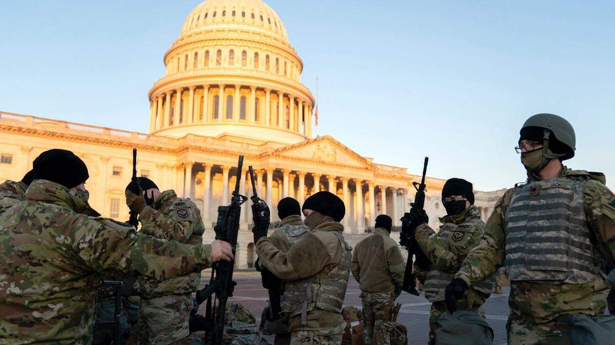 Members of the National Guard receive weapons outside the U.S. Capitol in Washington, D.C., on Jan. 13..