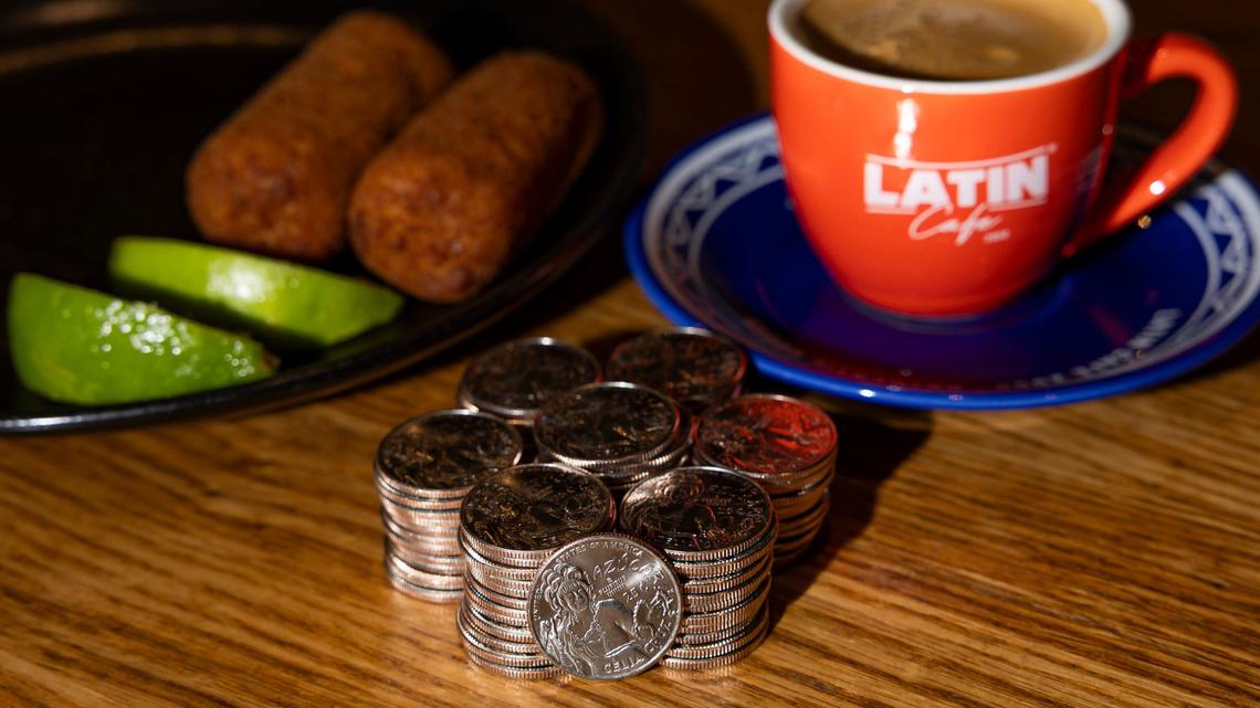 Celia Cruz-themed quarters are seen at a Latin Cafe 2000 on Monday, Aug. 19, 2024, in Miami, Fla. While supplies last, the restaurant is gifting customers who place orders over $50 and pay with cash a free Celia Cruz quarter. The coin is part of the U.S. Mint’s American Women Quarters Program, which aims to celebrate the accomplishments and contributions made by women of the United States.