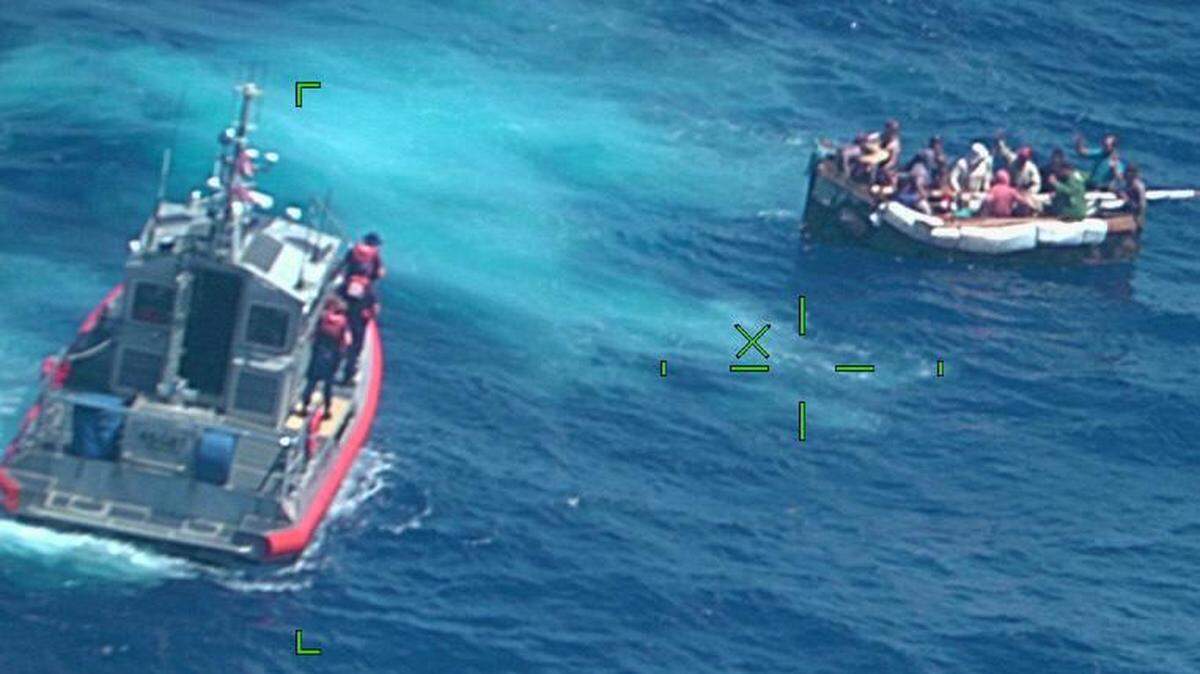 A Coast Guard Station Marathon law enforcement crew stops a rustic vessel about 17 miles south of Ramrod Key, Florida on April 16, 2022. The people were repatriated on Monday, April 18, 2022.