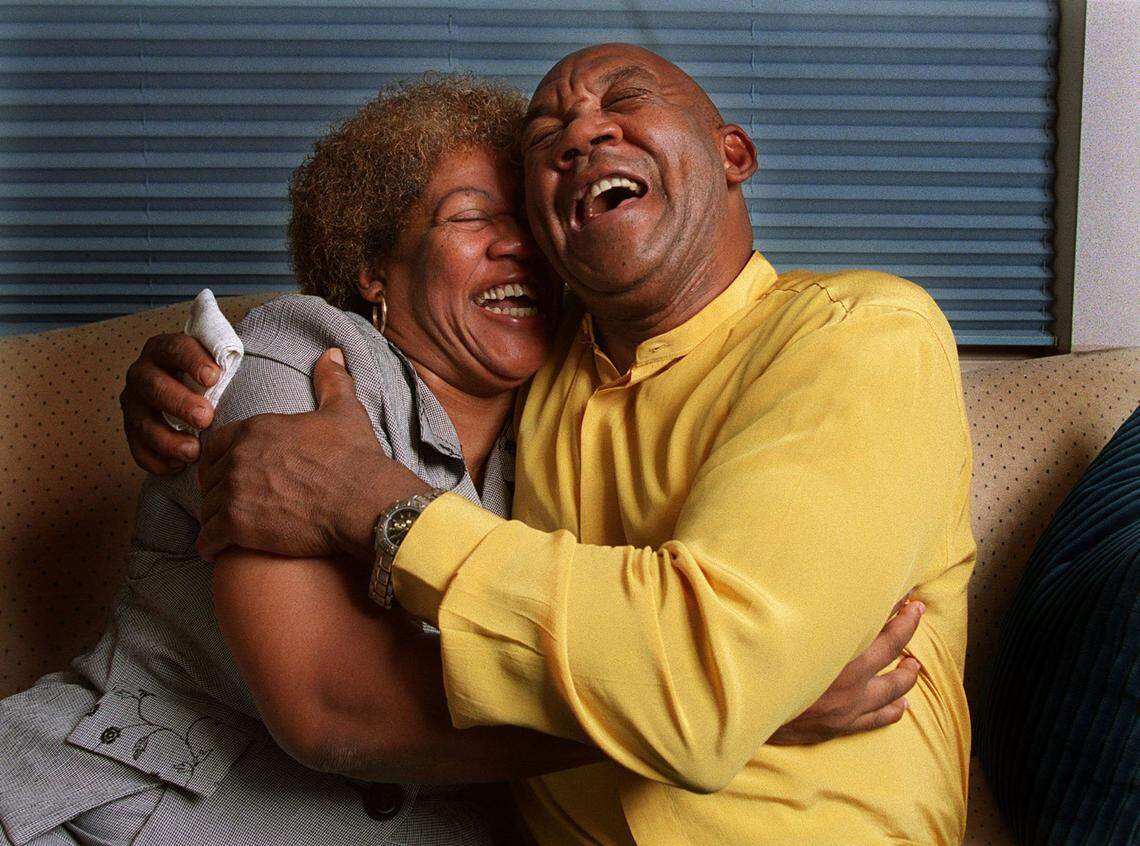6/27/01-CHARLES TRAINOR JR/HERALD STAFF-Fort Lauderdale - TOWNSEND - L to R - Mary Jones hugs her brother Jerry Townsend in his attorney’s office in Fort Lauderdale. Townsend was released from prison after DNA evidence cleared him of several crimes he was convicted of in the 80’s. (1of3)