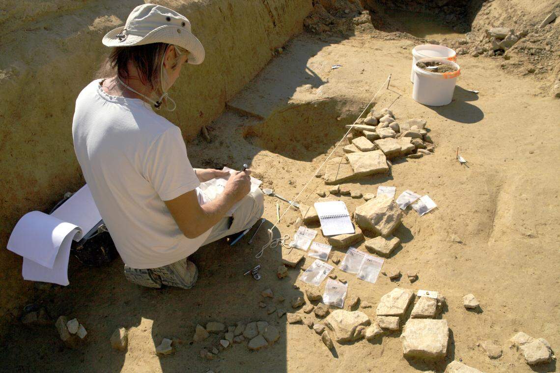 An archaeologist working at the Bellegarde site.