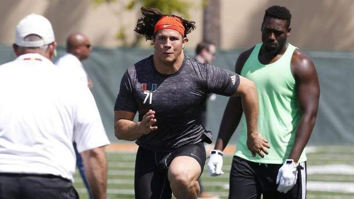 Defensive end Anthony Chickillo runs through drills as the University of Miami Hurricanes hold Pro Day, their local combine for the NFL Draft at Greentree Field in Coral Gables on Wednesday, April 1, 2015.