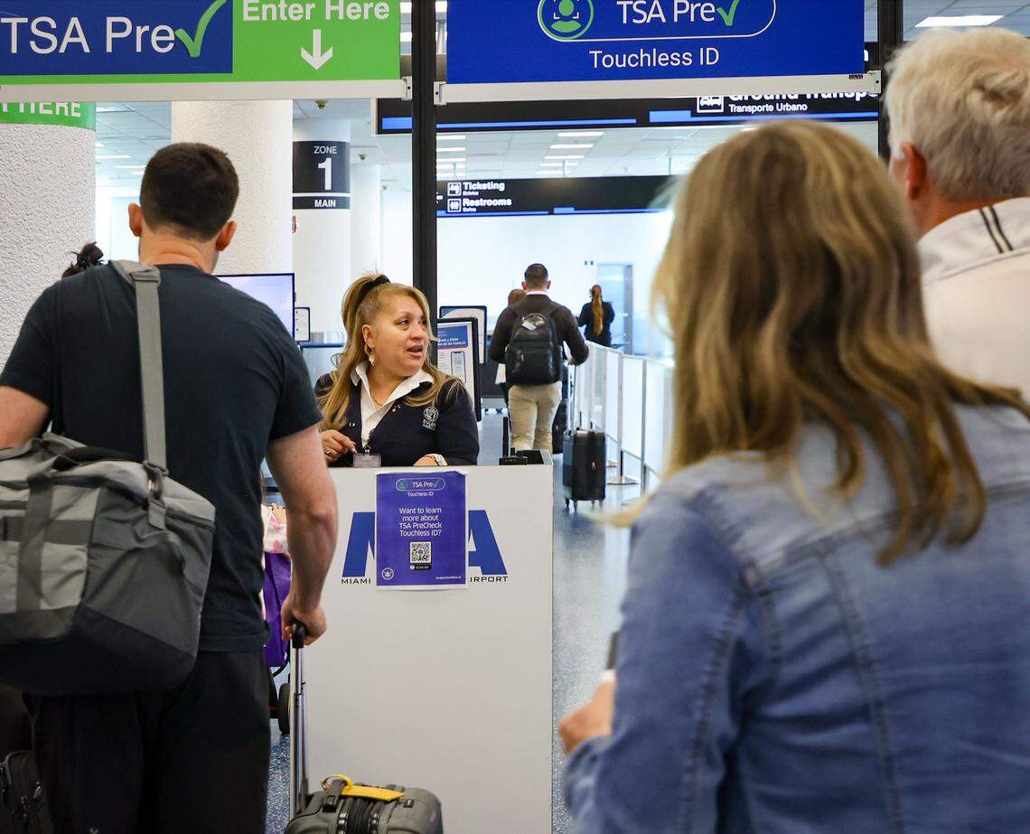 TSA PreCheck travelers are guided by an agent to which line to enter using the new Toucheless ID as Miami International Airport, along with American Airlines and the Transportation Security Administration, hosted a press conference to discuss the availability of TSA PreCheck® Touchless ID at MIA Door 1 in Departures on Tuesday, February 10, 2026, in Miami, Florida.