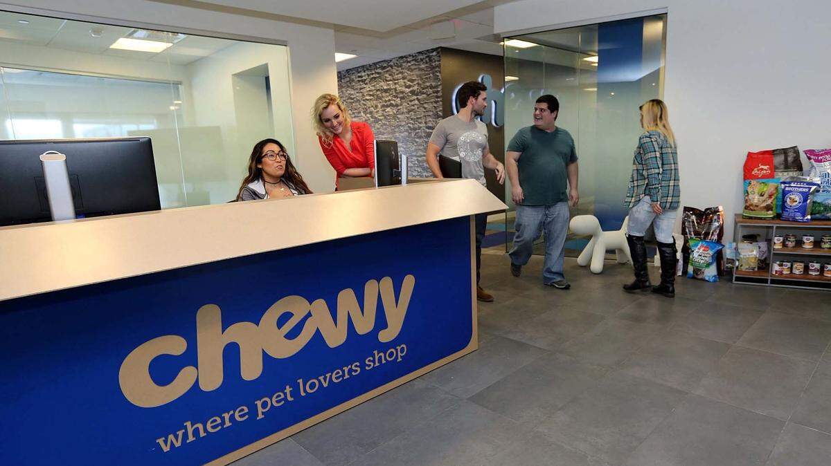 The front reception desk of Chewy.com is designed to look like a shipping box from Chewy.com.