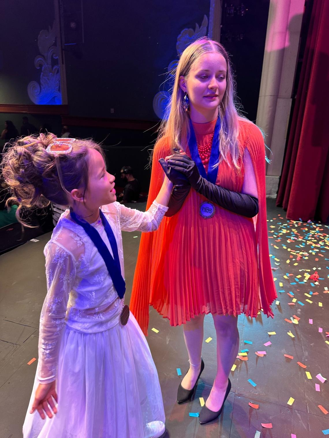 Champs celebrated one another after individual wins at the 2025 Young Talent Big Dreams finals competition at Actors’ Playhouse at the Miracle Theatre on May 10, 2025. Pictured Soleil Nation, 11, (left) and Nina Marie, 16, (right.)