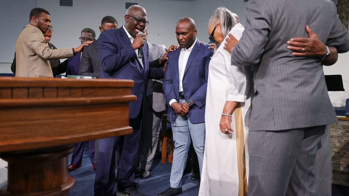 Faith leaders place their hands on Florida Sen. Shevrin Jones, center right, as Pastor Ranzer Thomas, center left, leads a prayer after Jones received endorsements from at least a dozen Black clergy in his campaign to replace outgoing Congresswoman Frederica Wilson, Monday, July 6, 2026, at Greater New Bethel Church in Miami Gardens, Fla. The show of support followed Wilson's endorsement of former Miami-Dade County commissioner Oliver Gilbert and came as Jones faces a crowded field of opponents after debating issues such as affordability, education, and federal policy last week.