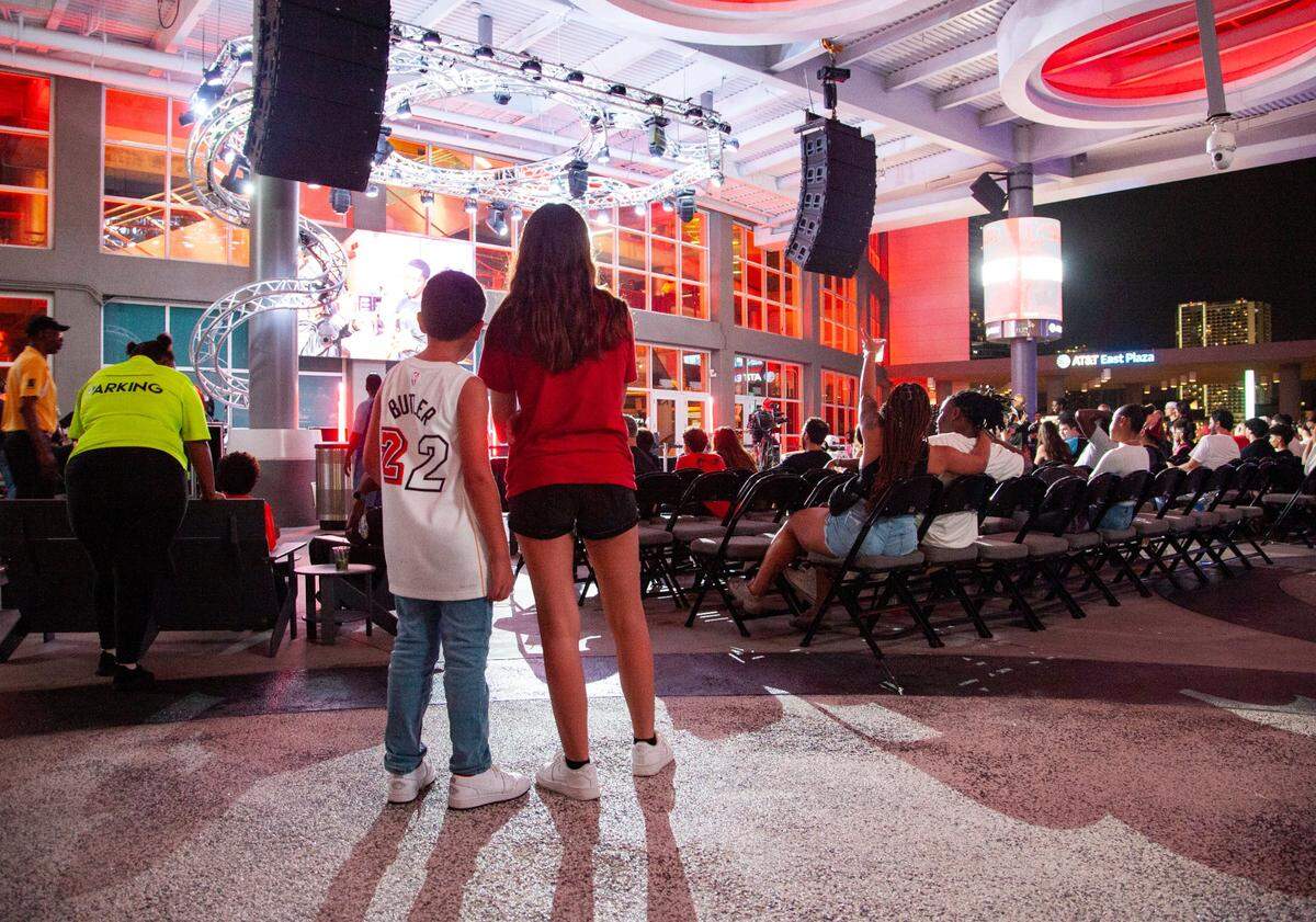 Siblings Luis, 8, and Valerie Batista, 13, stand together and watch during the 2023 Miami Heat Draft Watch Party at Kaseya Stadium on Thursday, June 22, 2023 in Miami, Florida.