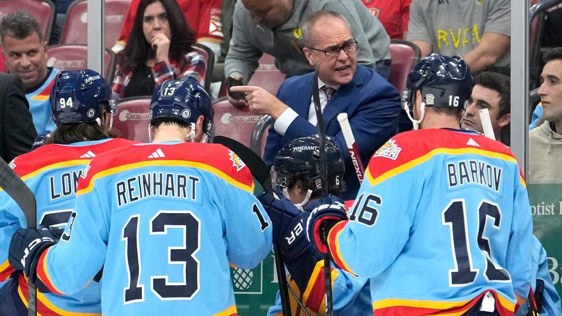Florida Panthers head coach Paul Maurice talks with his players during the second period of an NHL hockey game against the Seattle Kraken, Sunday, Dec. 11, 2022, in Sunrise, Fla. The Kraken won 5-2. (AP Photo/Lynne Sladky)