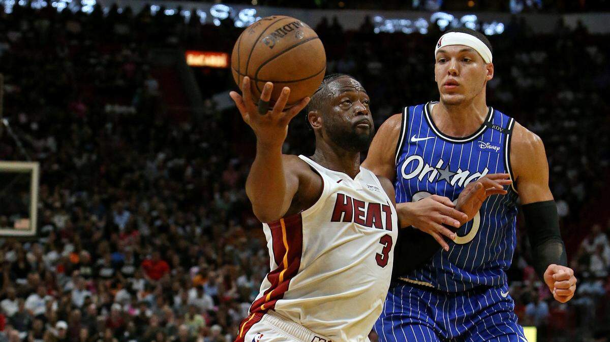 Miami Heat guard Dwyane Wade (3) drives against Orlando Magic forward Aaron Gordon (00) in the second quarter of an NBA basketball game at the AmericanAirlines Arena on Tuesday, March 26, 2019 in Miami.