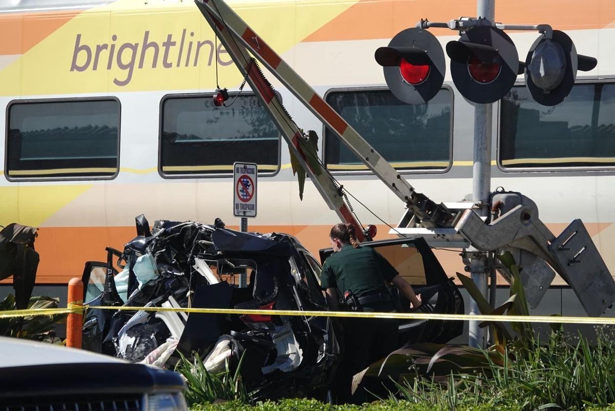 A Brightline train is stopped after striking a vehicle in Pompano Beach at Northeast Third Street and Dixie Highway just north of Atlantic Boulevard on Monday, Nov. 8, 2021.