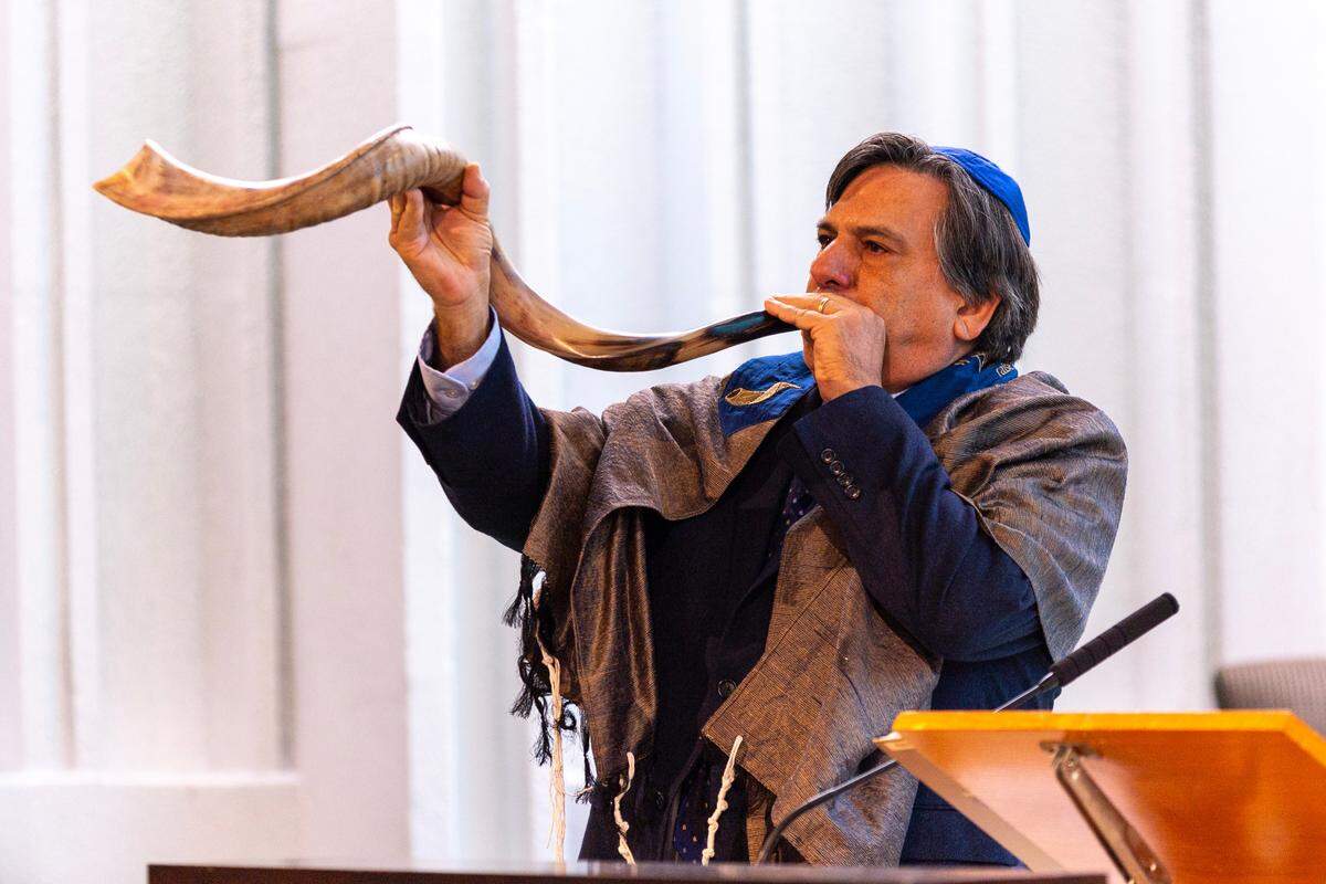 Edward Gross blows the shofar during Rosh Hashana services at Temple Judea in Coral Gables. The shofar is blown to represent themes of Malchuyot (sovereignty) and Zichronot (remembrance), an idea that’s woven throughout the Jewish New Year.