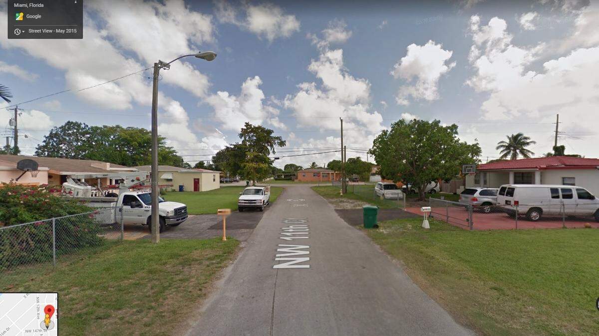 A Google Maps view of a street at 14735 NW 11th Avenue in northwest Miami-Dade.