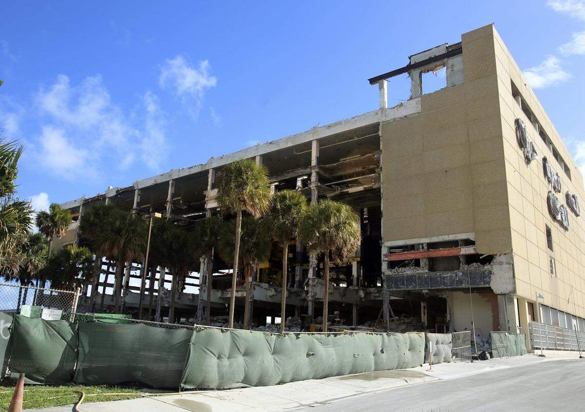 As demolition of the former Miami Herald building at One Herald Plaza continued Thursday, Dec. 4, 2014 in Miami, the section of the building that housed the printing presses resembles an open-air boat storage facility. The demolition firm, BG Group of Boca Raton, is razing the building using a “top down” method. The Genting Group bought the prime bayfront site; it may eventually house a resort and casino.