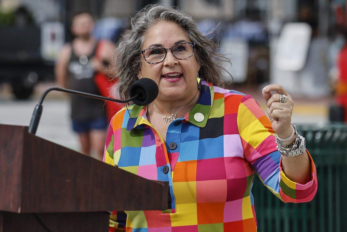 Miami Beach Commissioner Tanya K. Bhatt speaks as city officials and community members gather in Lummus Park for the unveiling of a rebuilt LGBTQ+ crosswalk made of 3,606 colorful pavers on Friday, April 10, 2026. The installation was created less than six months after the Florida Department of Transportation removed the original crosswalk at 12th Street and Ocean Drive in Miami Beach, Florida.