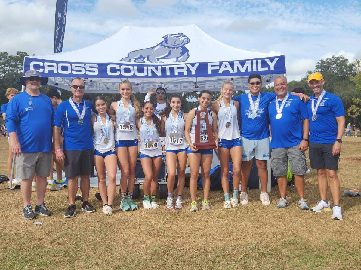 The Braddock girls’ cross country team poses for a picture after finishing as runner-up in the Class 4A state championship meet on Saturday, Nov. 5, 2022.