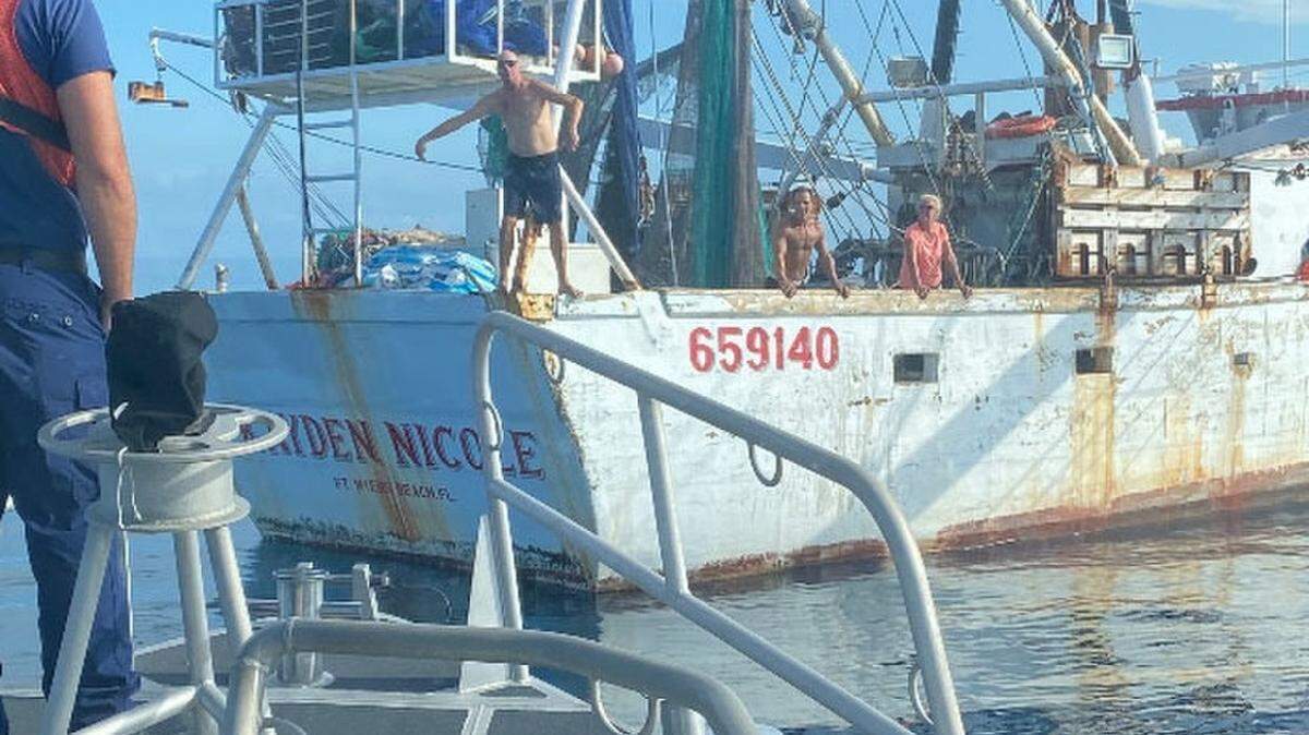 The captain of the fishing boat Kayden Nicole waves to Station Key West’s boat crew about 40 miles off the coast of Key West, Aug. 31, 2020.