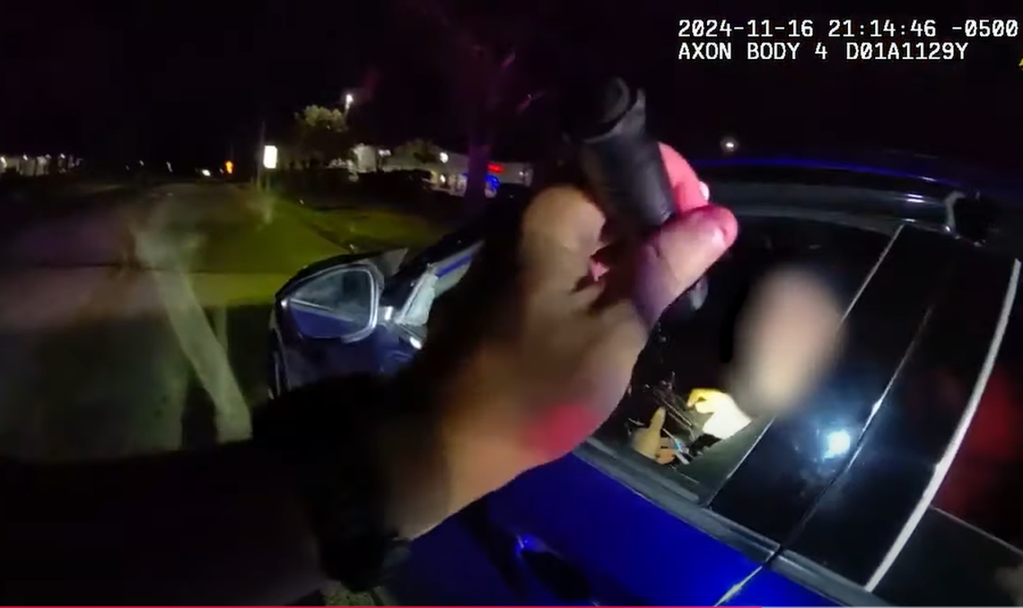 This video screengrab shows the moment something resembling a weapon was seen in the suspect’s hands, Florida investigators say.