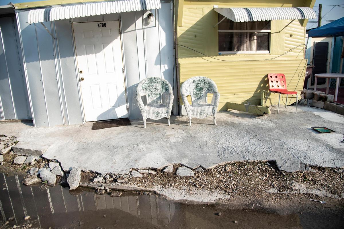 Sewage water mixes with leftover rainwater from a storm in the streets of Miami Soar mobile home park, 8050 NW Miami Court, on June 24, 2019.