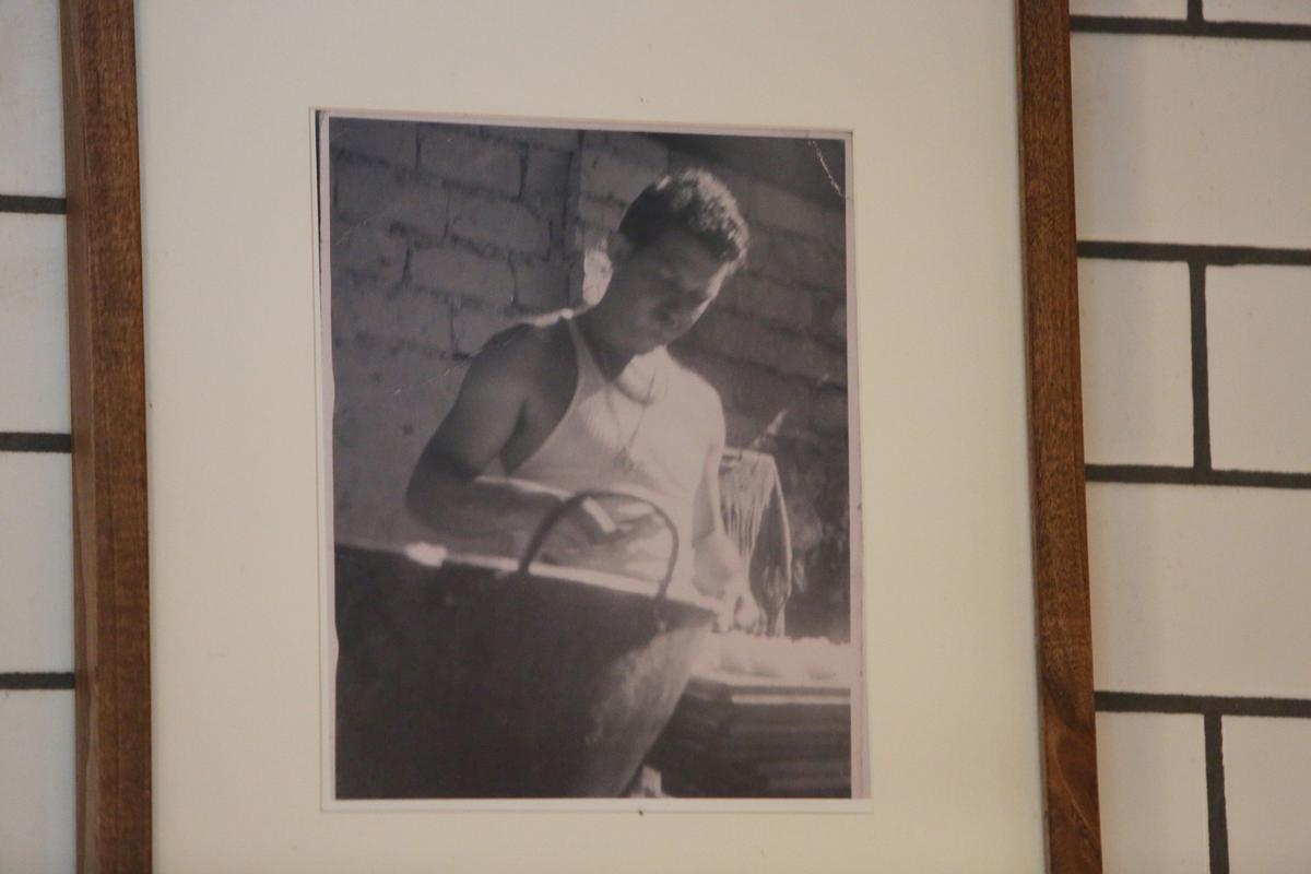 A photo of Michael Beltran’s grandfather, Miguel Guerra, hangs on the dining room wall of Beltran’s Coconut Grove restaurant, Ariete. Guerra was a pastry chef in Cuba at a restaurant also called Ariete.