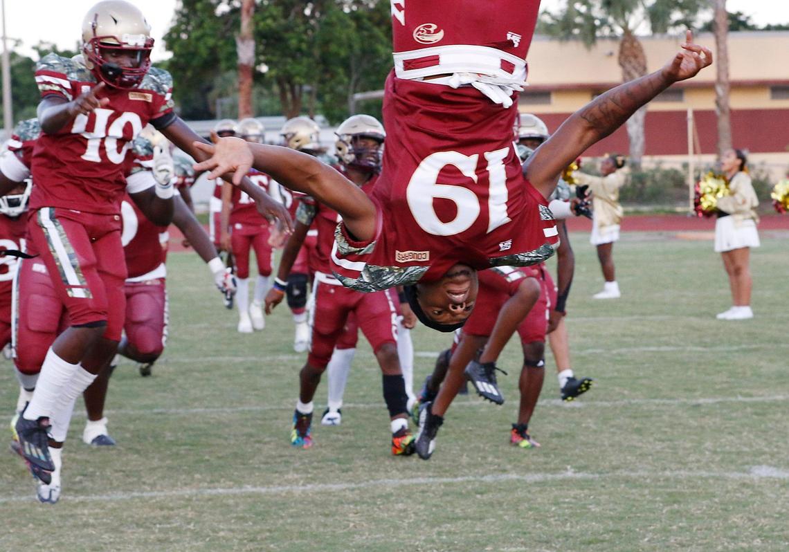 Coconut Creek Cougars take the field for a football game against Plantation Colonels on Thursday, September 4, 2023 at Coconut Creek HS in Coconut Creek. Andrew Uloza / for Miami Herald