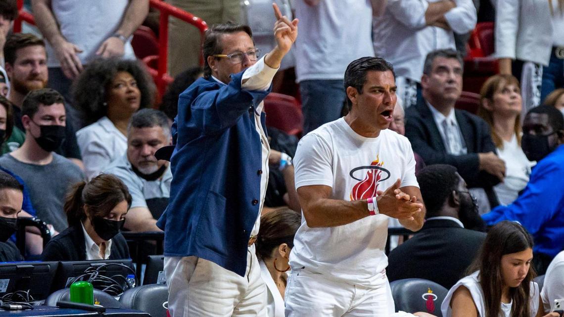 Mayor of Miami Francis Suarez, right, and technology entrepreneur Sean Wolfington, left, react from courtside during the first quarter of Game 1 of the NBA Eastern Conference Finals series between the Miami Heat and the Boston Celtics at FTX Arena in Miami, Florida, on Tuesday, May 17, 2022.
