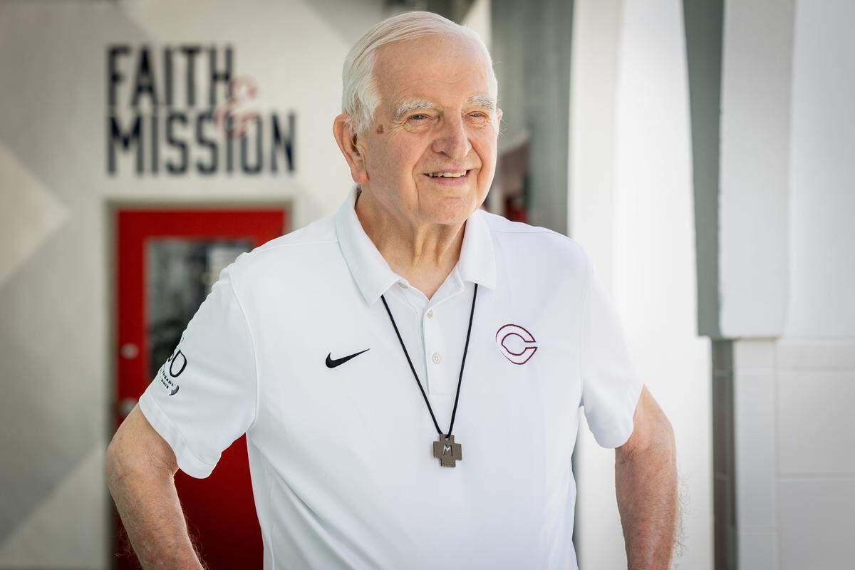 Brother Kevin Handibode stands in the hallway at Christopher Columbus High School on Friday, May 22, 2026 in Miami, Fla. After 54 years of service to Christopher Columbus High School, Brother Kevin Handibode will retire at the end of this academic year at the age of 87.