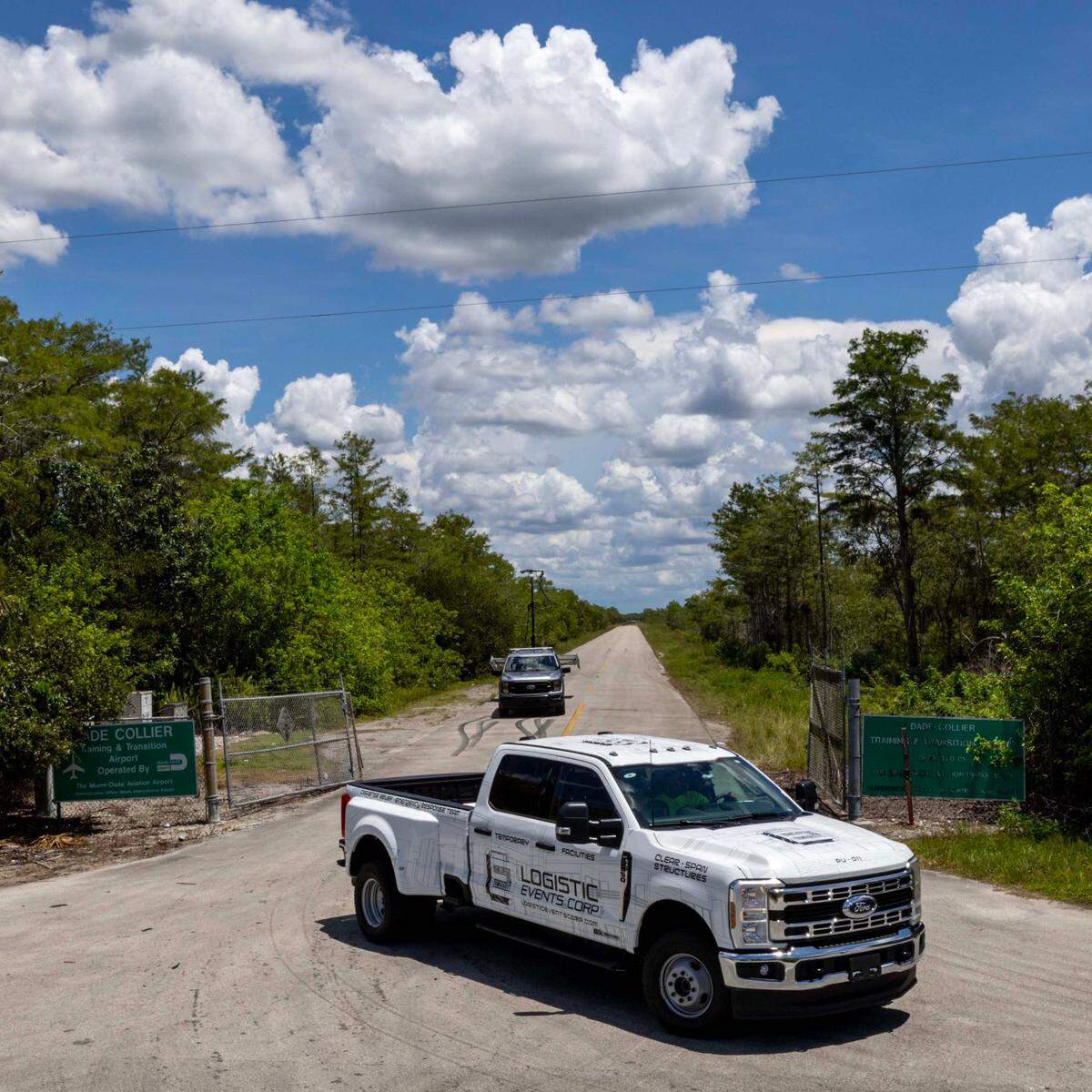 A Logistics Event Corp. truck pulls out of Dade Collier Training and Transition Airport off Tamiami Trail on Monday, June 24, 2025.
