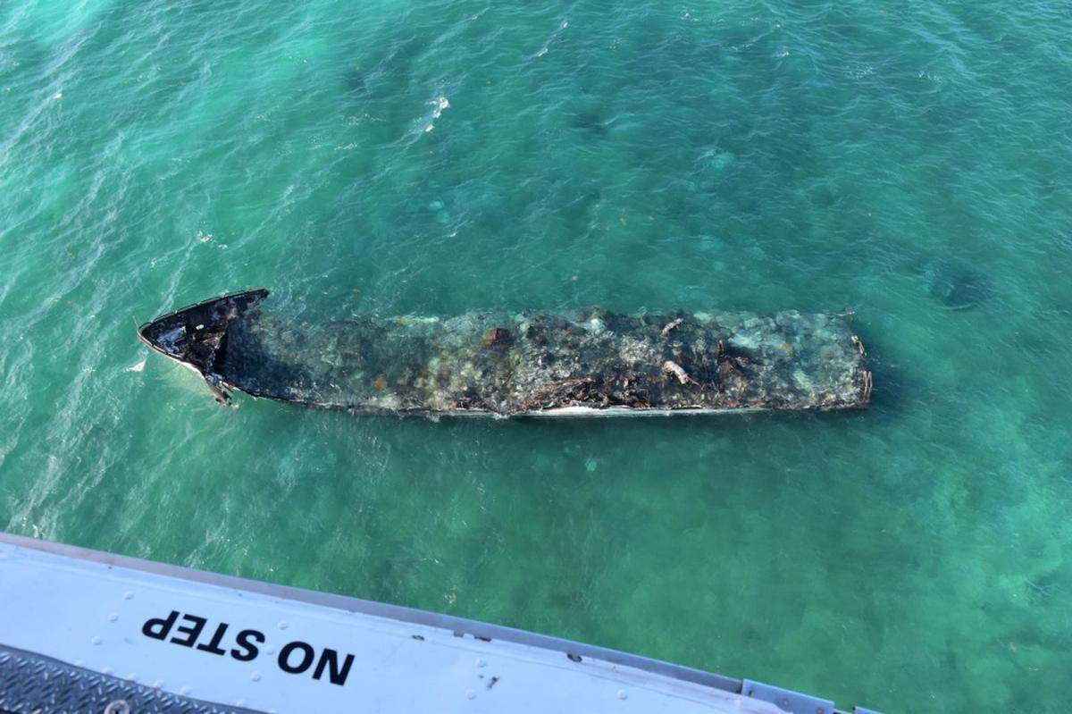 The wreckage of the 100-foot yacht, La Dolce Vita, sinks near the Marquesas on March 16, 2021. The Coast Guard is overseeing diesel spill cleanup operations.