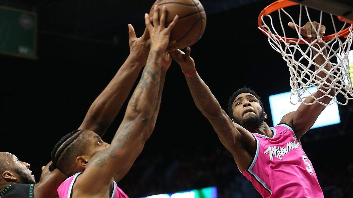 Heat guard Derrick Jones Jr. (5) fights for an offensive rebound in the second quarter against the Minnesota Timberwolves Sunday, Dec. 30, 2018, at the AmericanAirlines Arena in Miami.
